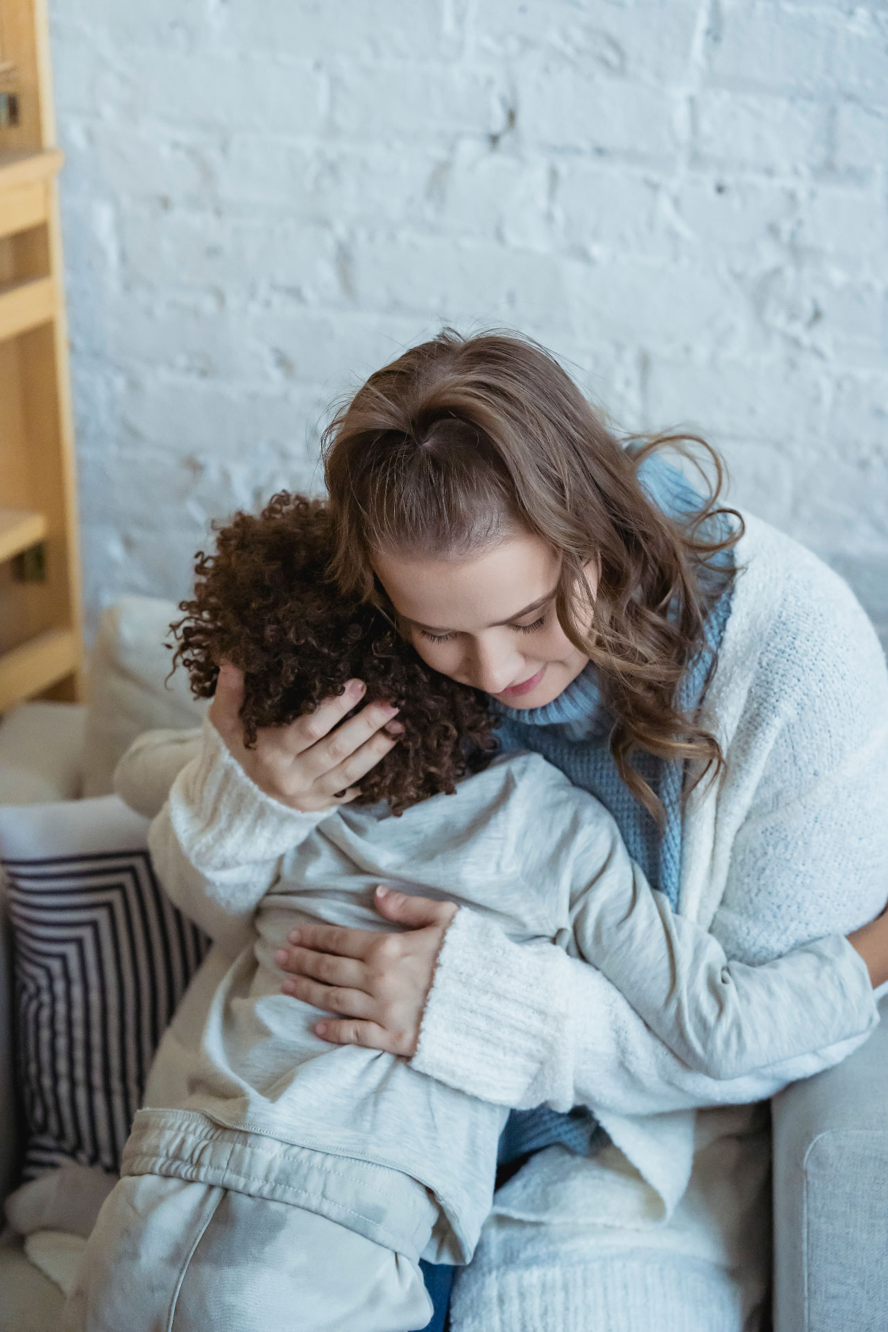 A parent hugging their child